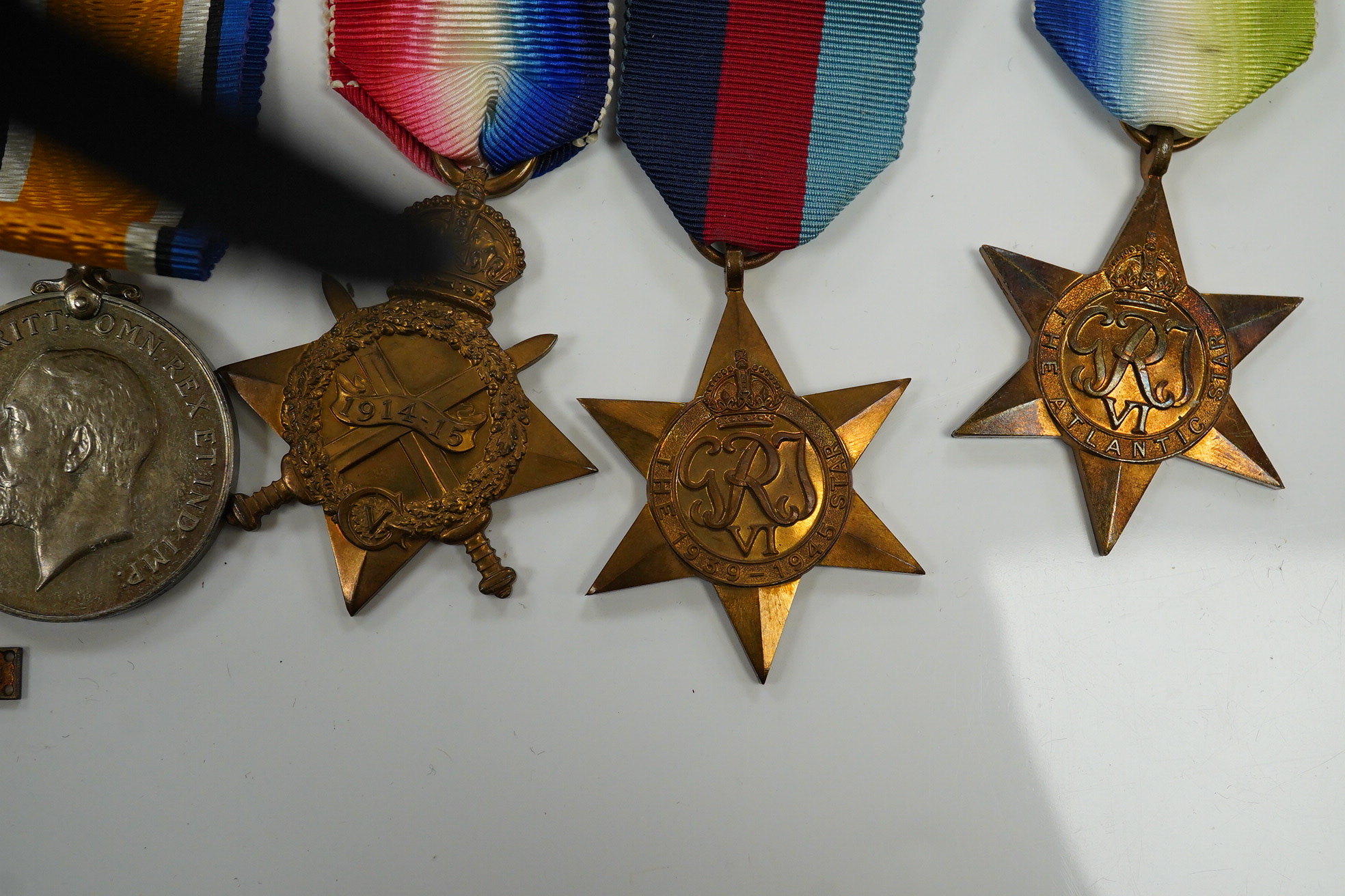 A WWI and WWII medal group awarded to R. Whitham A.B. R.N.; a First World War medal trio with a George V Long Service and Good Conduct Medal, together with a 1939-1945 Medal, the Atlantic Star, and the 1939-1945 Star. Co